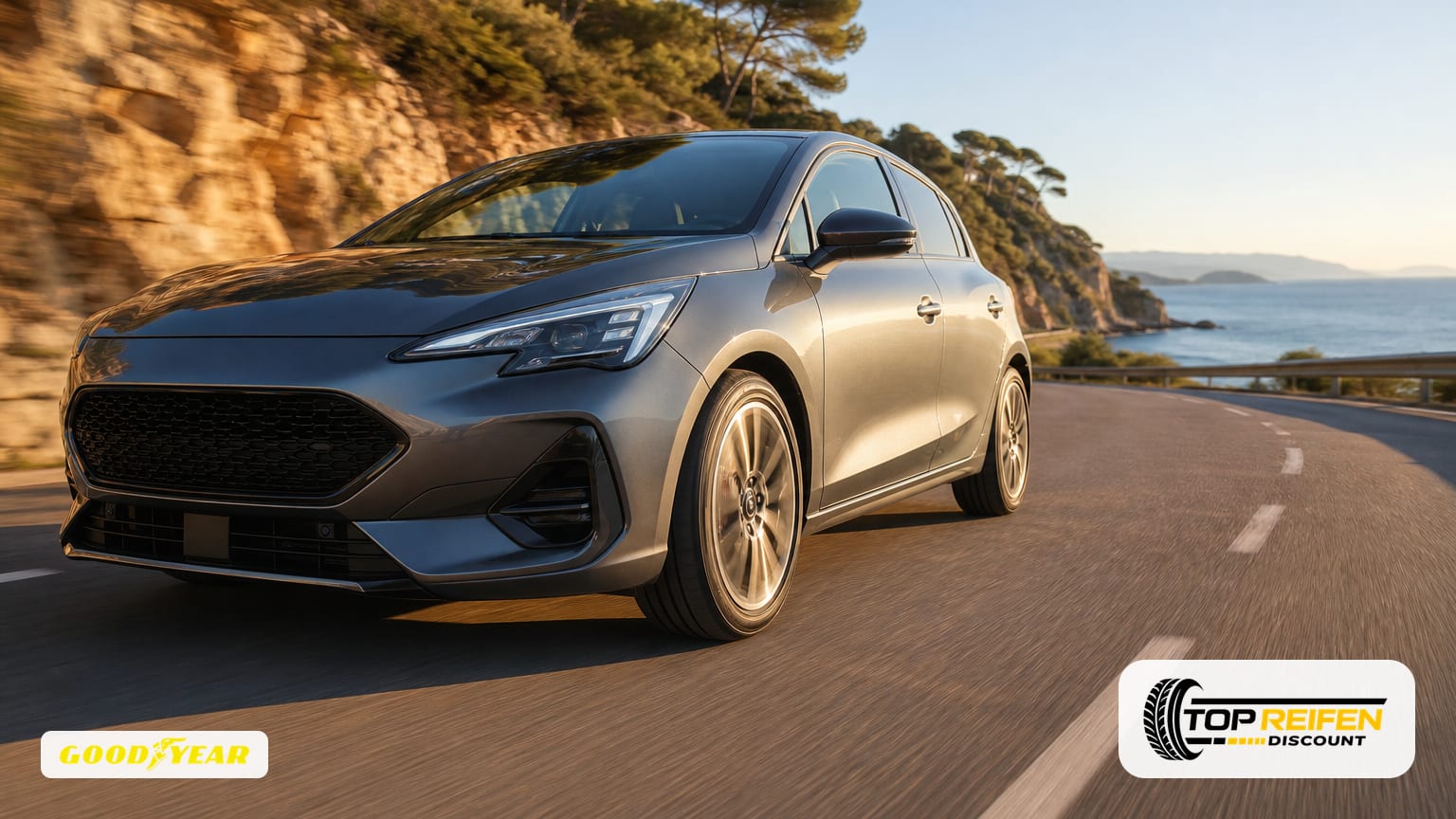 Dynamic front three-quarter shot of a compact car on a sunny coastal road, fitted with GOODYEAR EF-PE2 175/65 R17 tyres; dry asphalt, motion blur, summer vibe.